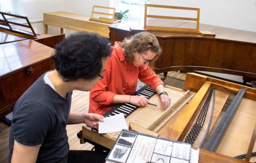A student learns how to regulate a piano