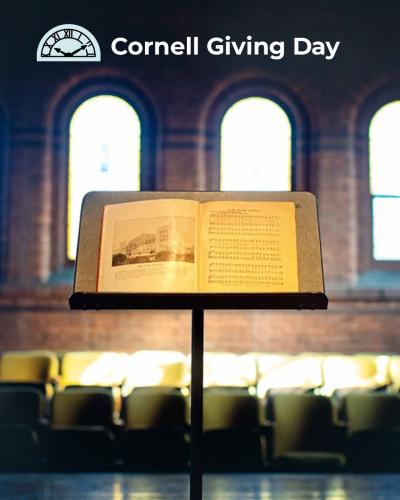 A picture of a music stand with Cornell Giving Day logo above it.